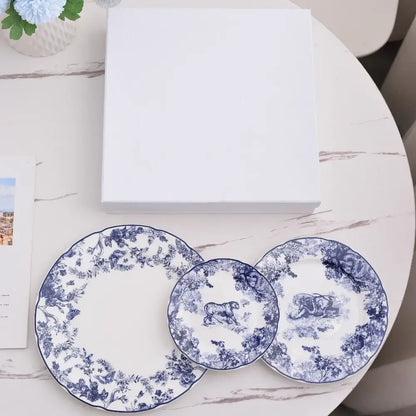 Set of three white ceramic jungle bone china toile animal plates with blue floral motifs and scalloped edges for dining decorbites jungle bone
