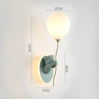 Cute mint-green ceramic bear balloon wall light with glowing glass lampshade and brass stem for children bedroom decorbites bear balloon
