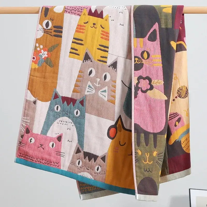 Kids cute cats multicolored cotton gauze bath towel featuring vibrant yellow, pink, blue, orange, and teal hues by decorbites kids cute