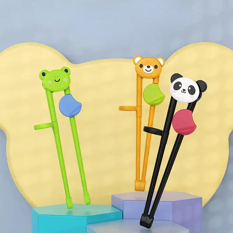 Set of three decorbites kids multicolor training chopsticks with bear panda and frog cartoon designs for dining use