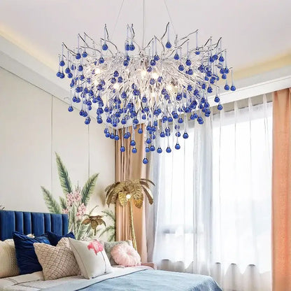 A modern kids pink crystal chandelier with a silver metallic frame and blue glass orbs for bedroom decorbites kids pink