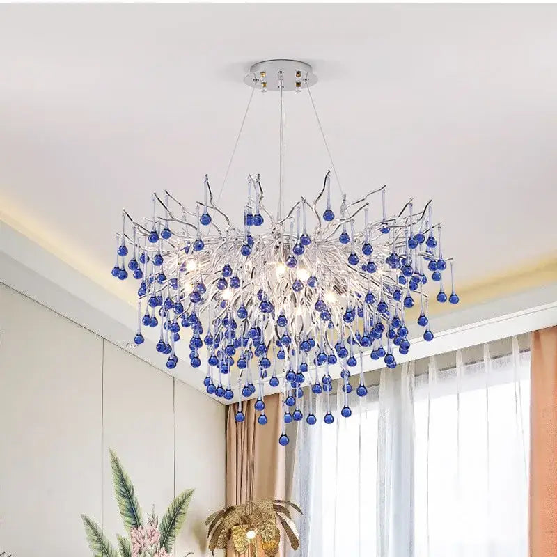 A modern kids pink crystal chandelier with silver frame and blue glass orbs for bedroom decorbites kids pink decor
