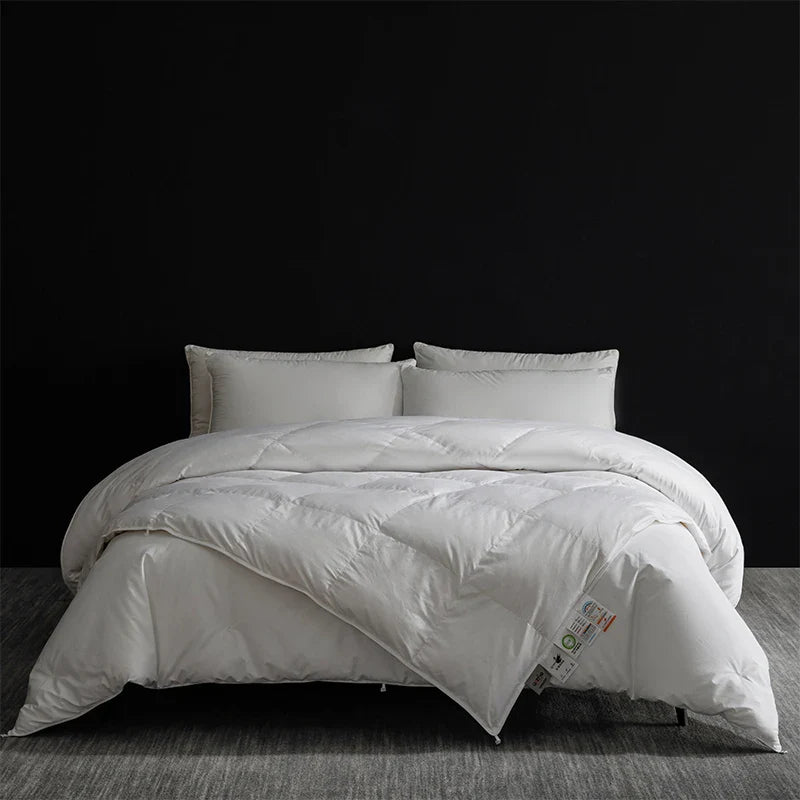 King size white quilted down comforter with plush texture and subtle stitching in goose down and silk duvet set