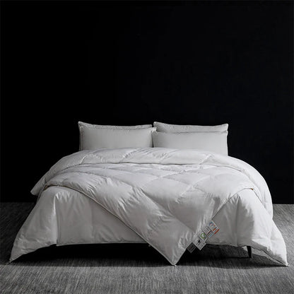 King size white quilted goose down and silk duvet set with soft plush texture and subtle stitching patterns