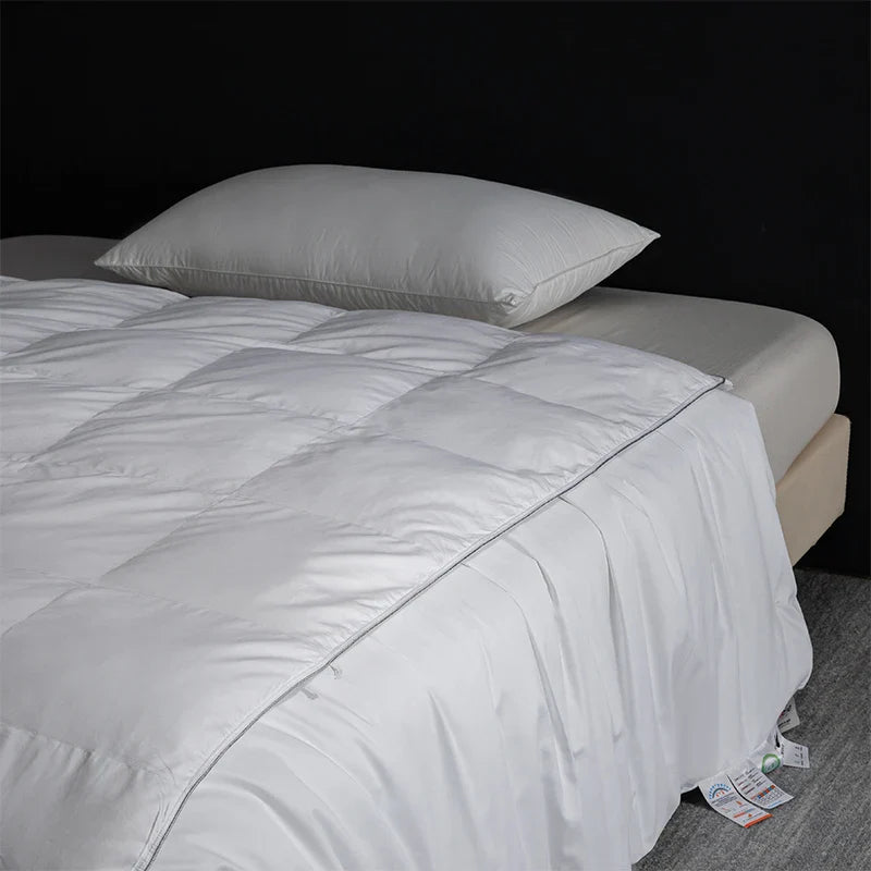 White quilted king size goose down and silk duvet set with smooth satin finish and subtle edge stitching