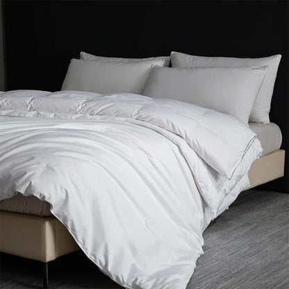 White quilted king size goose down and silk duvet set with smooth satin finish and subtle stitching details