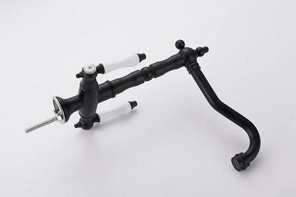 Black matte single hole kitchen faucet with white ceramic handles and curved spout made of gold brass material
