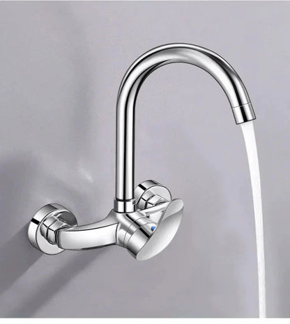 Chrome finished wall mounted kitchen faucet with sleek curved spout and dual control knobs for hot and cold water mixing