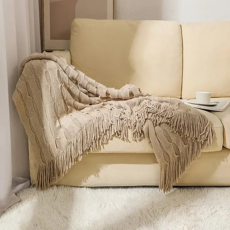 Beige decorbites knitted geometric throw blanket with cable knit pattern and long fringe for textured bedroom decor