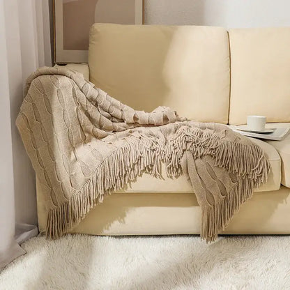 Beige decorbites knitted geometric throw blanket with cable knit pattern and long fringe for textured bedroom decor