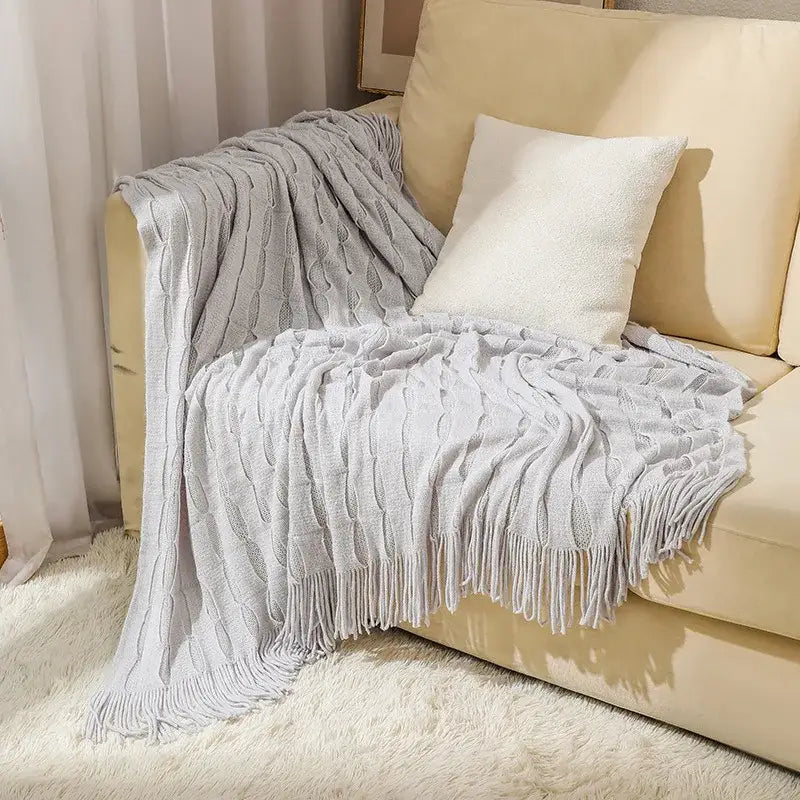 Light gray decorbites knitted geometric throw blanket with textured cable pattern and fringe trim for bedroom decor