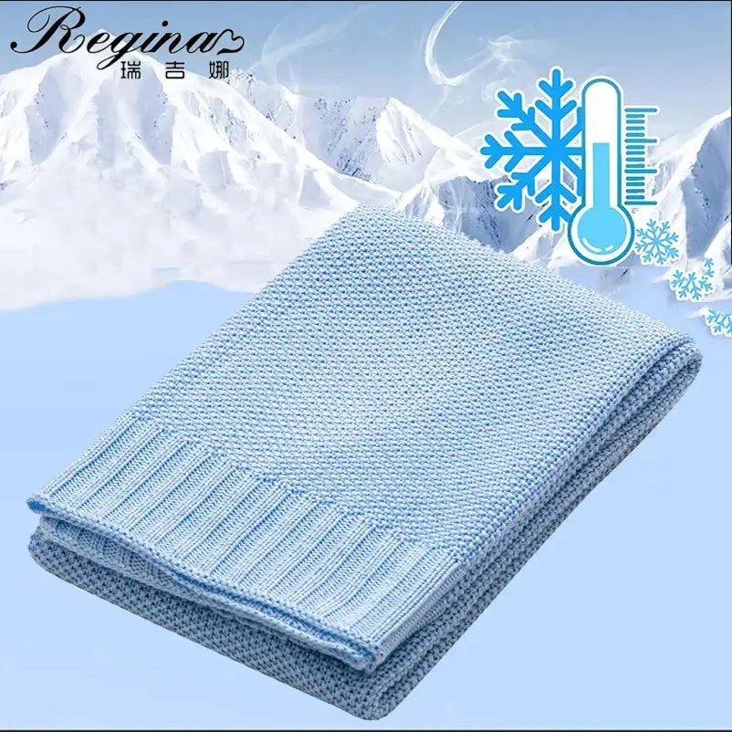 Knitted light blue bamboo baby blanket with textured breathable weave and ribbed edges for nursery use