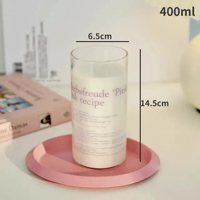 Clear glass candle jar with white wax on pink tray featuring decorbites korean glass cups design for kitchen use