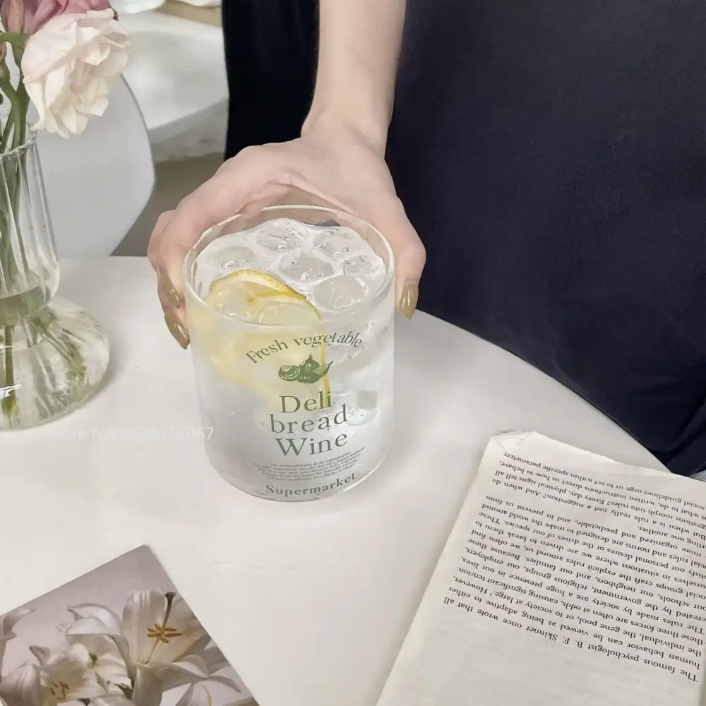 Clear glass tumbler with frosted text and lemon slice inside from decorbites korean glass cups collection