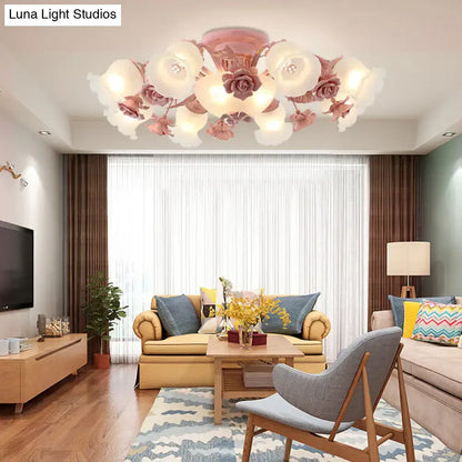 A korean garden flower ceiling light with delicate pink and white rose-shaped frost glass shades for bedroom decor
