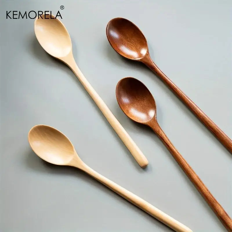 Set of four kemorela wooden spoons in natural and medium brown finishes with smooth minimalist design for dining