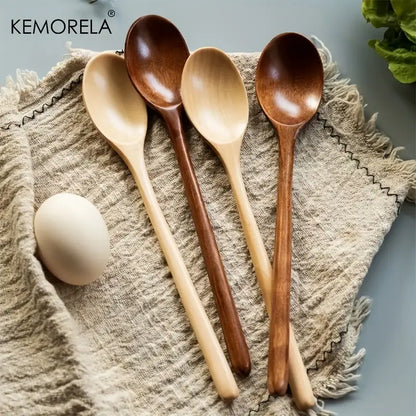 Set of four kemorela wooden spoon set in natural and dark brown finishes with smooth handcrafted surfaces