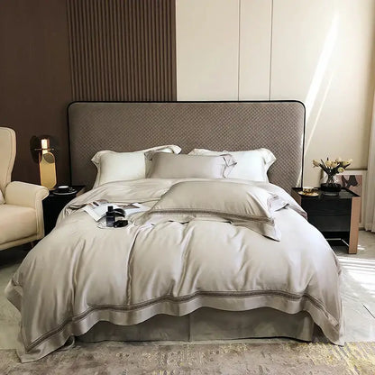 Beige satin bedding set with subtle embroidered trim made from decorbites eucalyptus lyocell luxury material