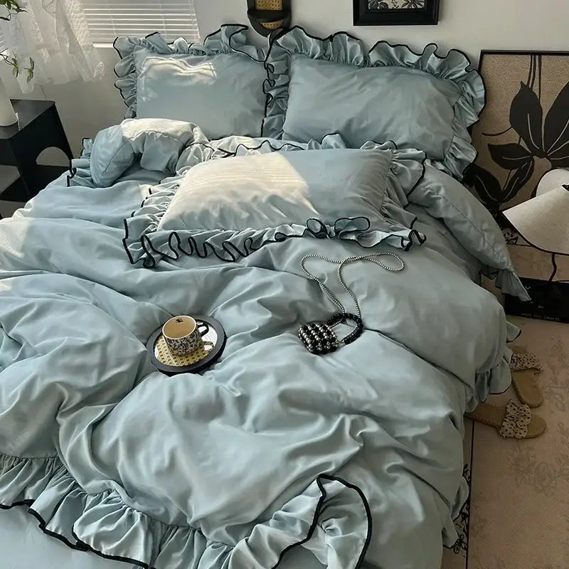Light blue satin bedding set with black ruffled trim from decorbites cooling silky ruffled lavender and black collection