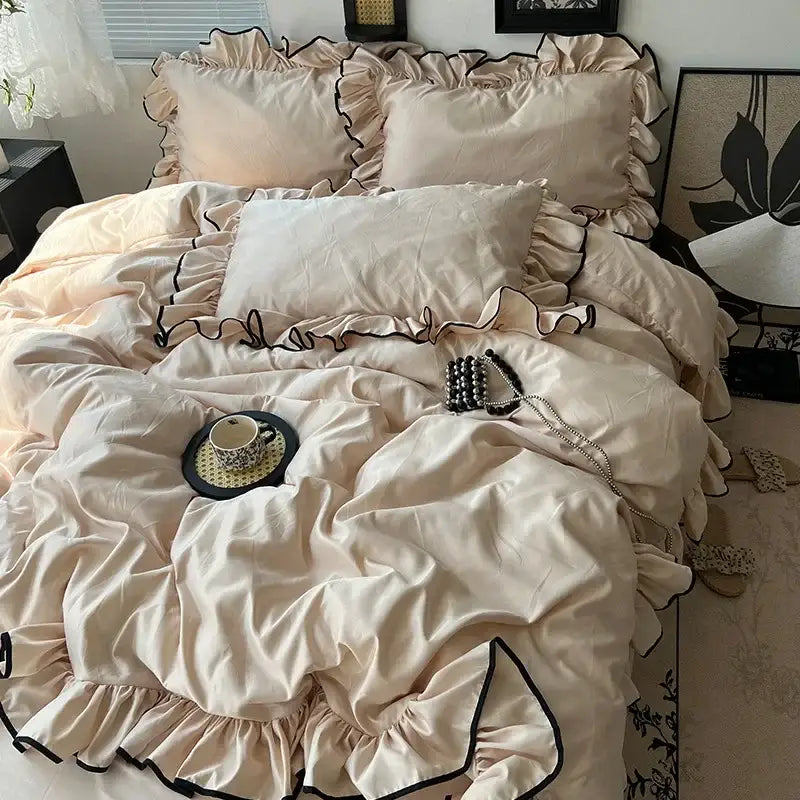 Cream-colored satin bedding set with black ruffled trim for decorbites cooling silky ruffled bedroom decor