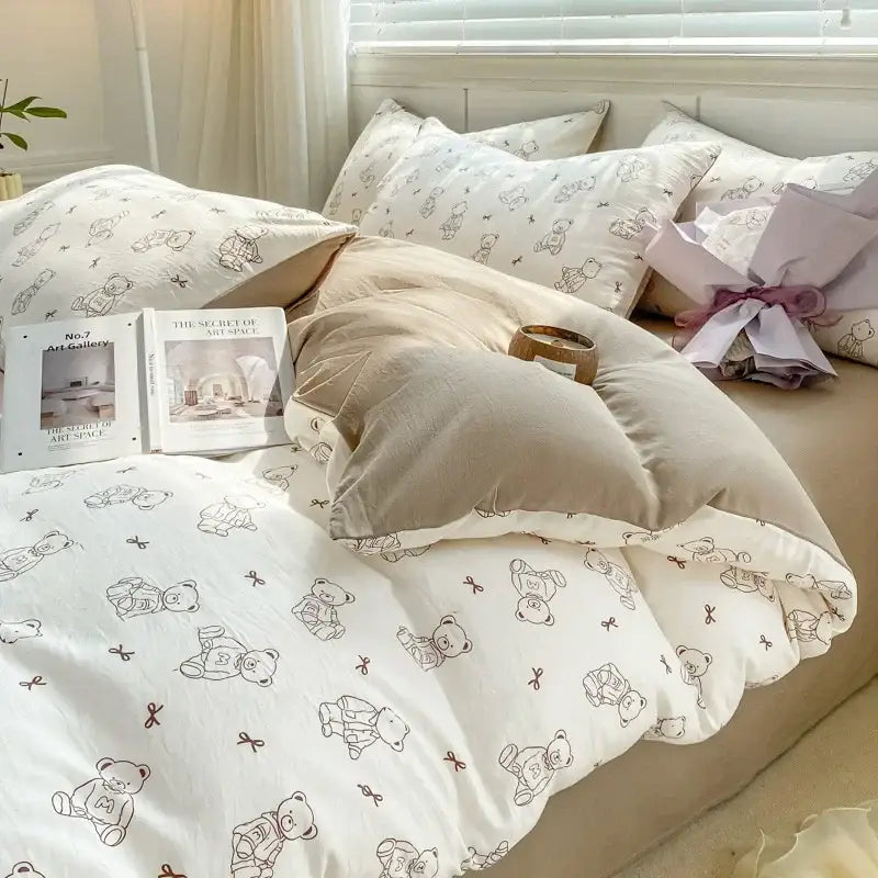 White cotton duvet cover with cozy pattern printed teddy bears and bows in soft brown tones for bedding set decorbites