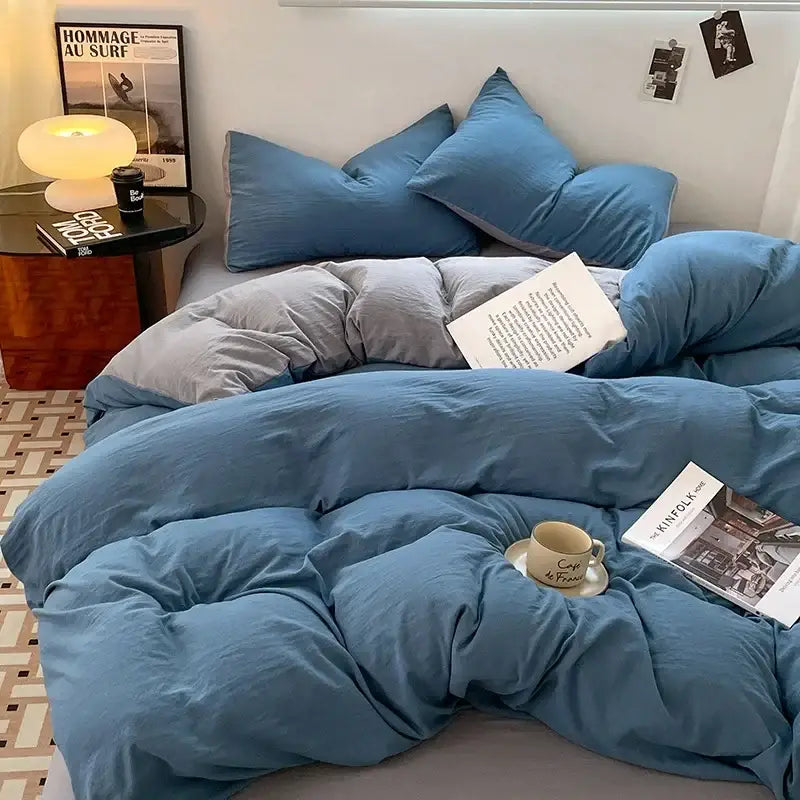 Lavender and black cotton bedding set with blue and gray quilted duvet featuring a cozy textured fabric finish