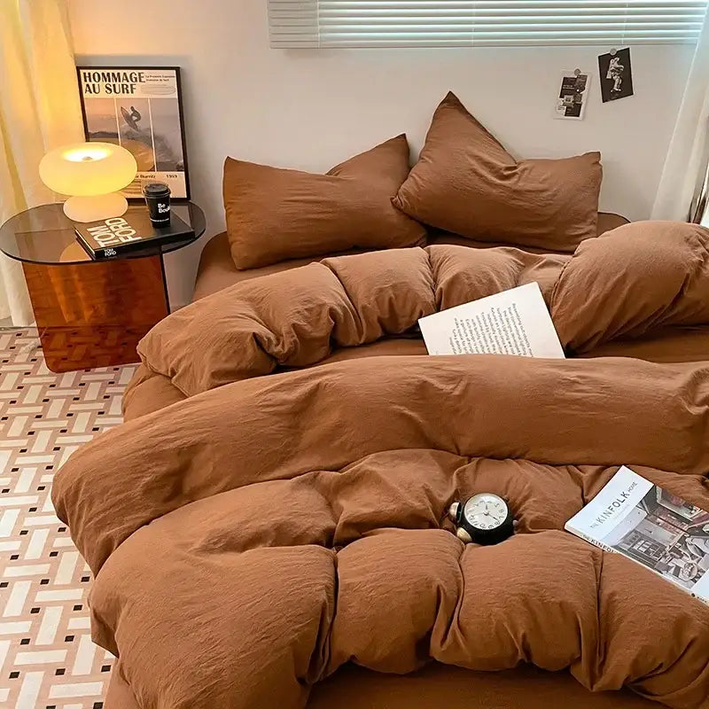Cozy brown cotton bedding set with soft textured finish featuring duvet and matching pillows for bedroom comfort