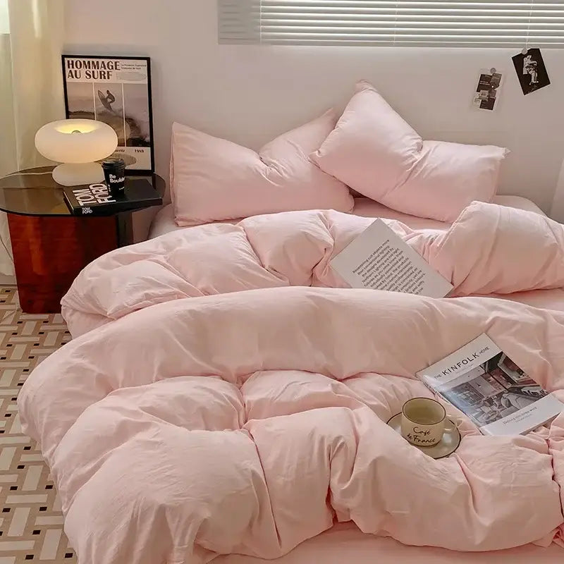 Pink quilted cotton bedding set with soft plush texture and matching pillows for comfortable bedroom use