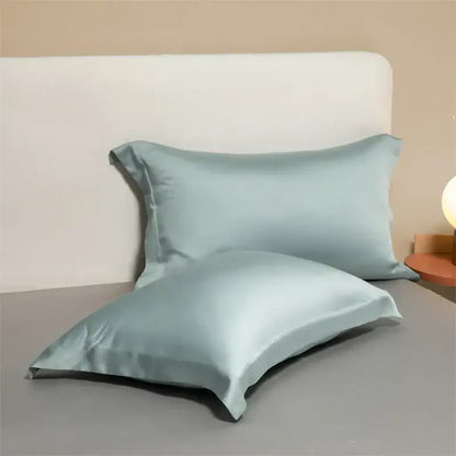 Two light blue satin egyptian cotton pillowcases with smooth glossy finish from lavender cotton pillowcase set