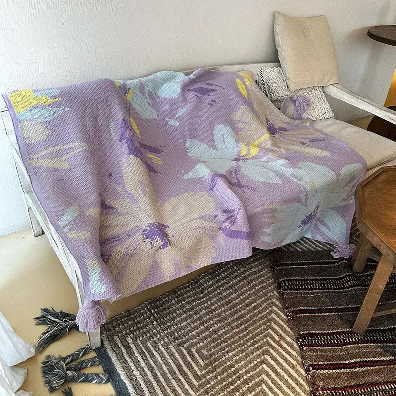 Lavender floral cozy knit blanket by decorbites featuring delicate purple yellow cream floral pattern and tassels