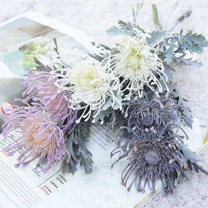 A bouquet of artificial chrysanthemums in white lavender and gray with textured foliage for decorbites artificial crab claw branch decor