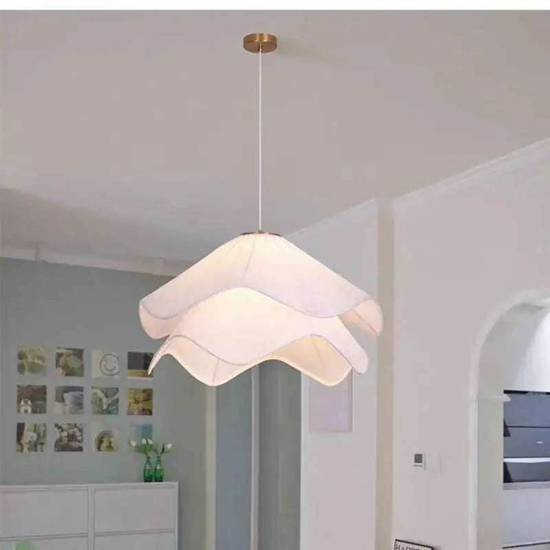 Layered white fabric pendant light with gold-toned mount for dining room featuring decorbites led white design