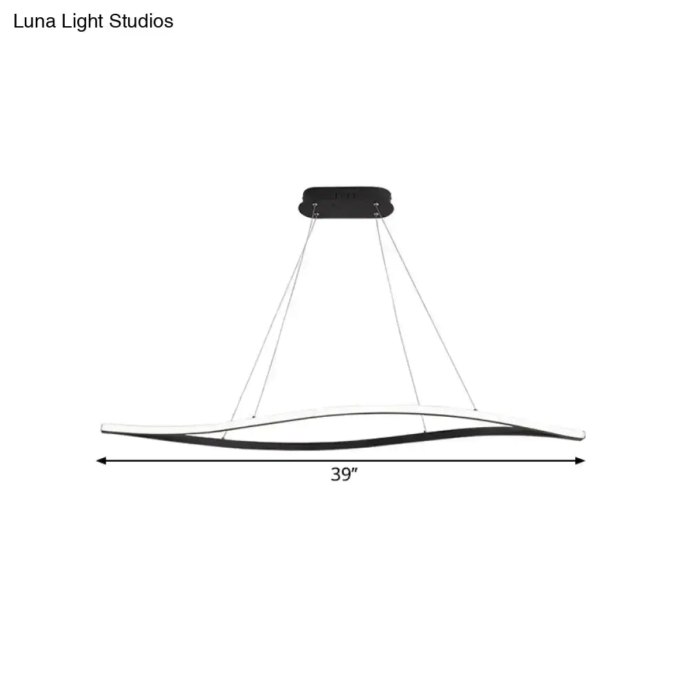 Modern black and white led island lamp with sleek curved design and black leaf frame in warm color temperature