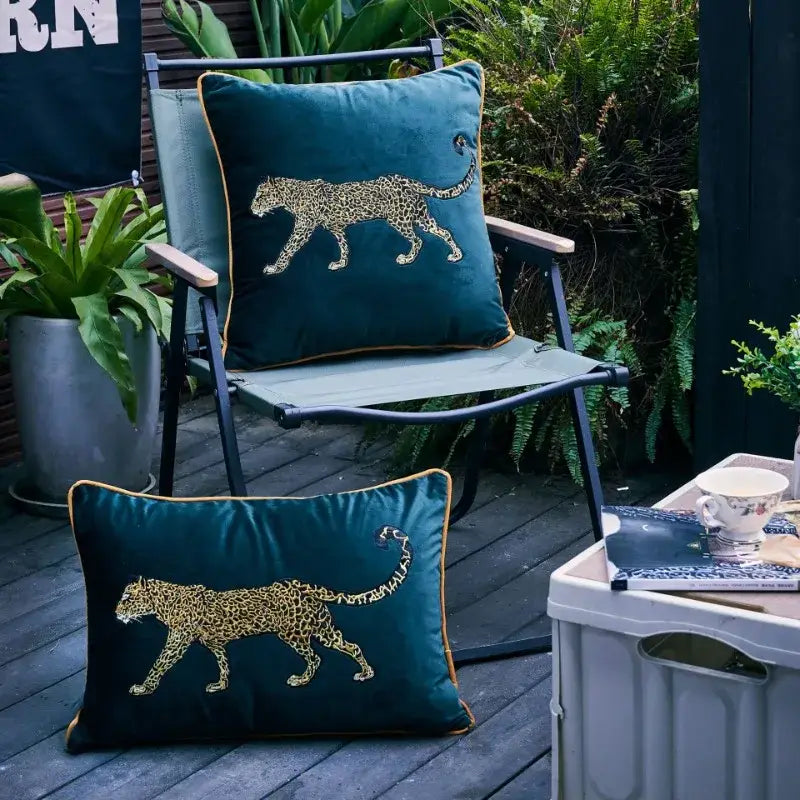 Deep teal velvet decorative pillowcase with decorbites leopard embroidered golden design and gold-trimmed edge