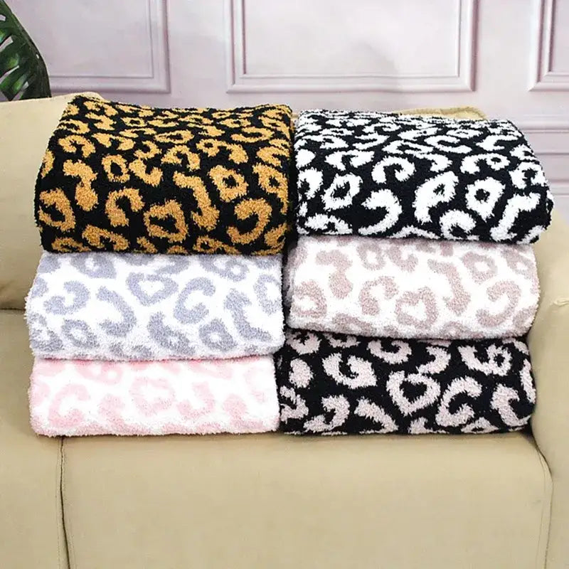 Soft plush leopard print cozy flannel velvet blankets in black gold white gray and pink cream for bedroom sofa decorbites cozy flannel