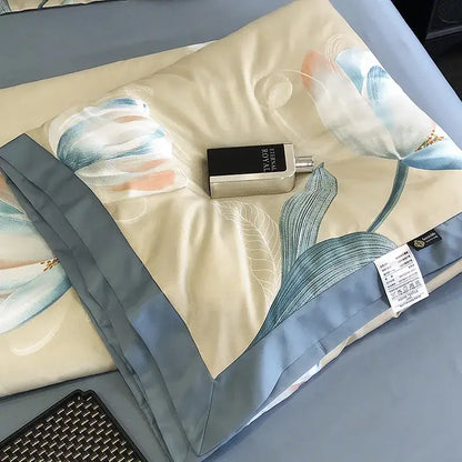 A silver and black perfume bottle on a cream and blue satin pillow sham with leopard print decorbites design
