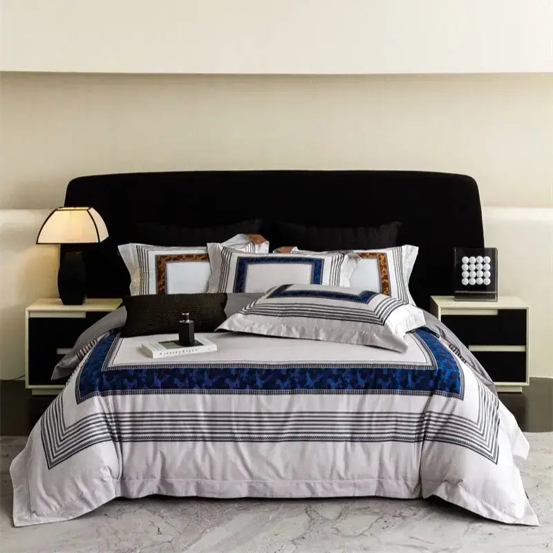 Luxury bedding set with sophisticated white base, bold navy geometric borders, and striped accents in decorbites 1000tc egyptian cotton