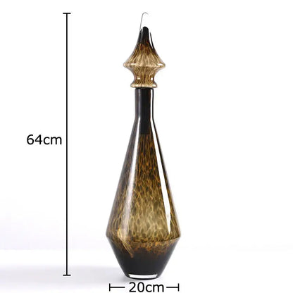 A tall 64cm amber and black leopard print glass decanter with a fluted stopper for living room decorbites decor
