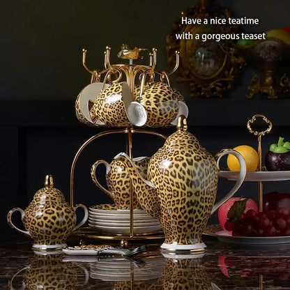 Leopard print ceramic coffee set with gold accents and matching tiered stand decorbites leopard print dining room decor
