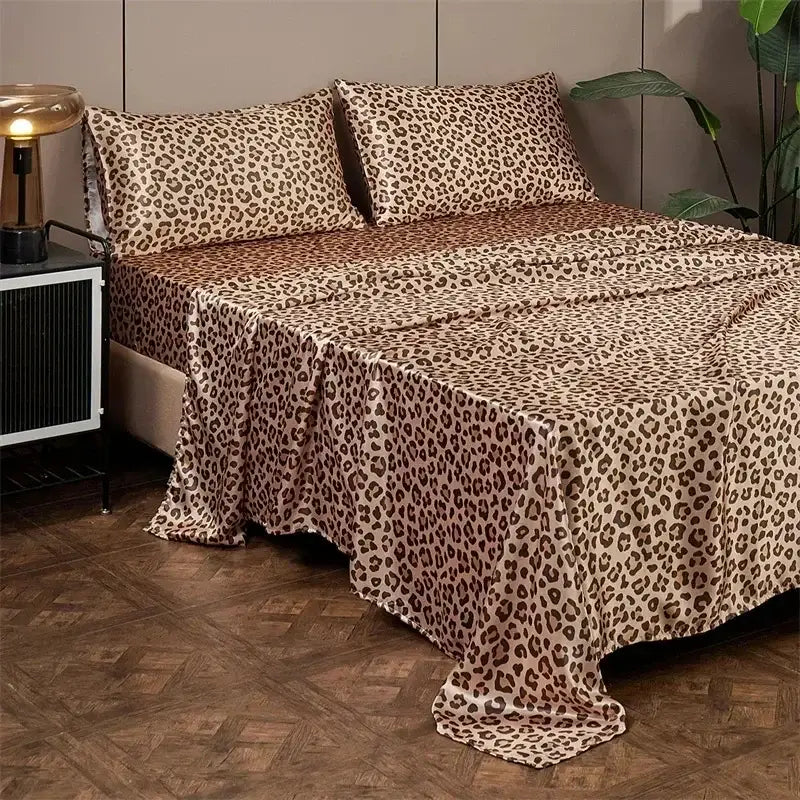 Leopard print satin bedsheet set with beige base and dark brown spots made of smooth fabric for bedroom bedding