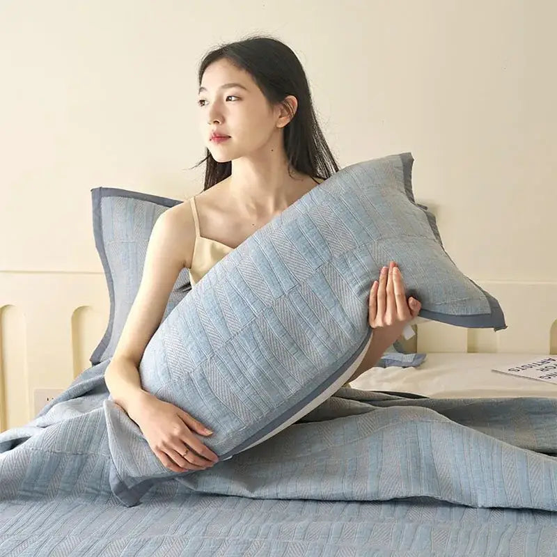 Light blue and gray decorbites cotton summer cool quilt towel blanket with textured pillow and dark gray piping edges