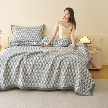 Gray and white geometric-patterned decorbites cotton summer cool quilt with matching towel blanket and triangular design