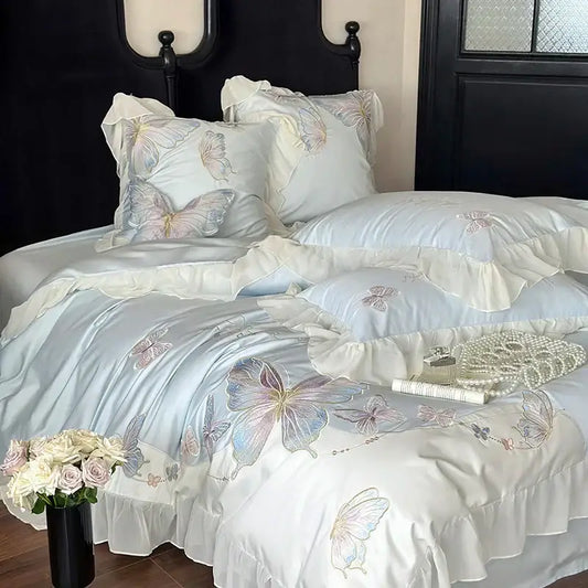 Light blue satin bedding set with delicate butterfly embroidery and soft ruffled edges by decorbites french lace