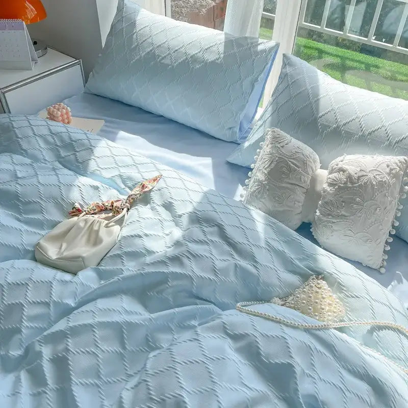 Light blue diamond grid jacquard bedding set with quilted design and white lace trim for bedroom comfort