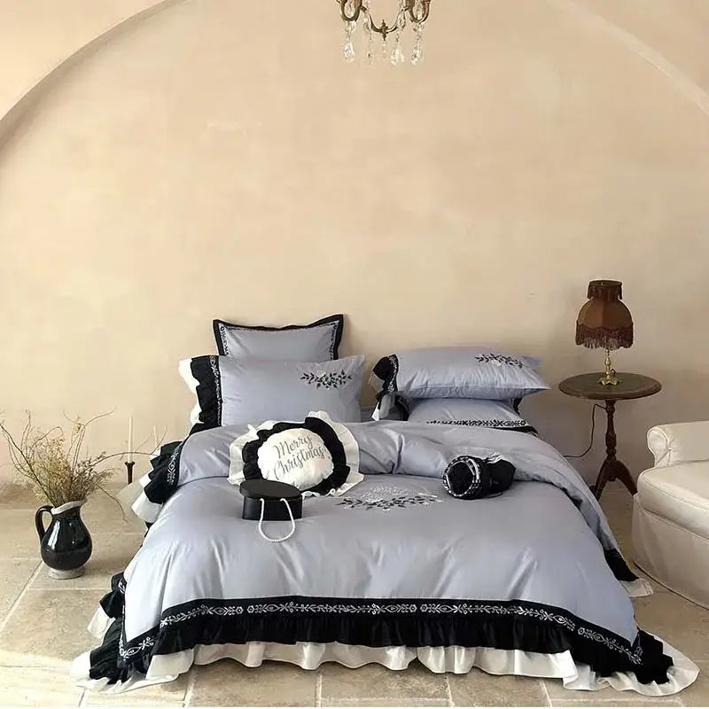 Light blue and black embroidered bedding set with flowers embroidery ruffles and ruffled edges for bedroom decor