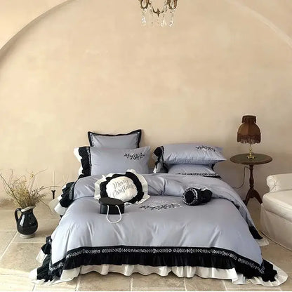 Light blue and black embroidered bedding set with flowers embroidery ruffles and ruffled edges for bedroom decor