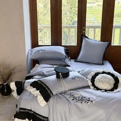 Light gray and black bedding set with flowers embroidery ruffles and ruffled trim for elegant bedroom decor