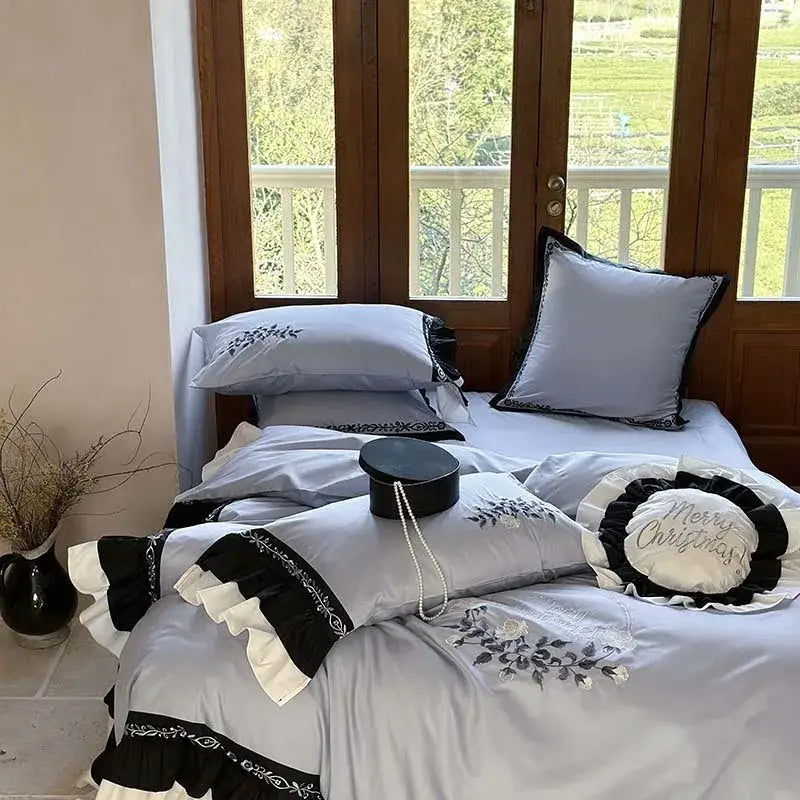 Light gray and black bedding set with flowers embroidery ruffles and ruffled trim for elegant bedroom decor