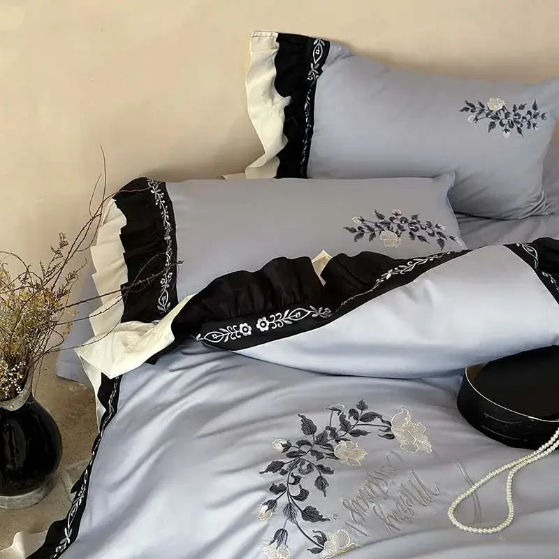Light blue satin bedding set with black and white flowers embroidery ruffles for elegant bedroom decorbites decor