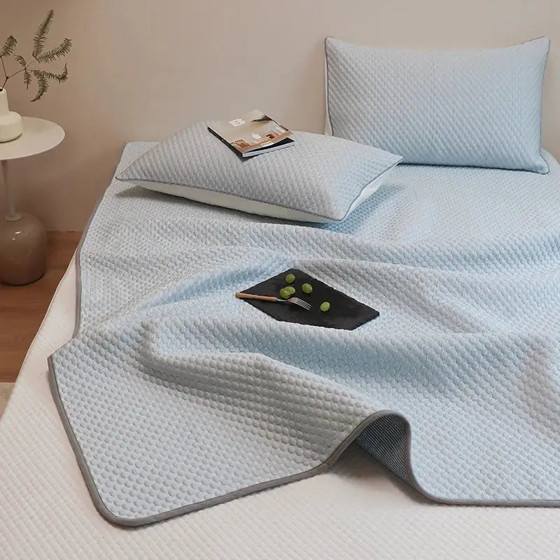 Light blue quilted cooling mattress pad with gray border from decorbites ice bean bed sheet set for cooling sleep